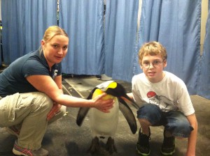 Katy Wozniak and Gavin with a King Penguin at the Pittsburgh Zoo